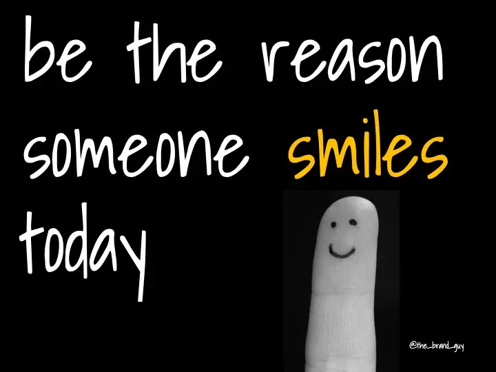 Slide reading "be the reason someone smiles today" beside a fingertip with a drawn smiley face