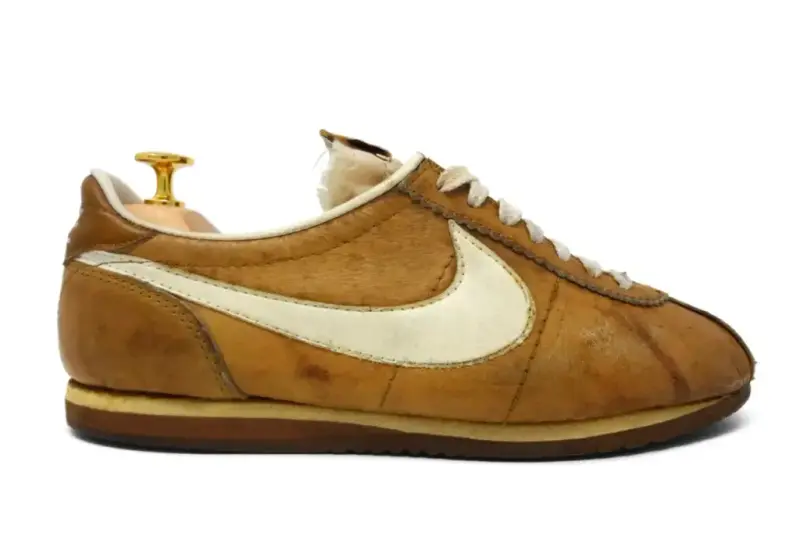 Vintage 1970s Nike Le Village tan leather shoe with a cream swoosh