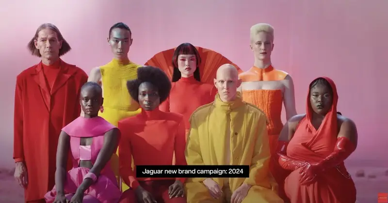 Jaguar 2024 brand campaign: models in bold red, pink and yellow outfits against a pink backdrop