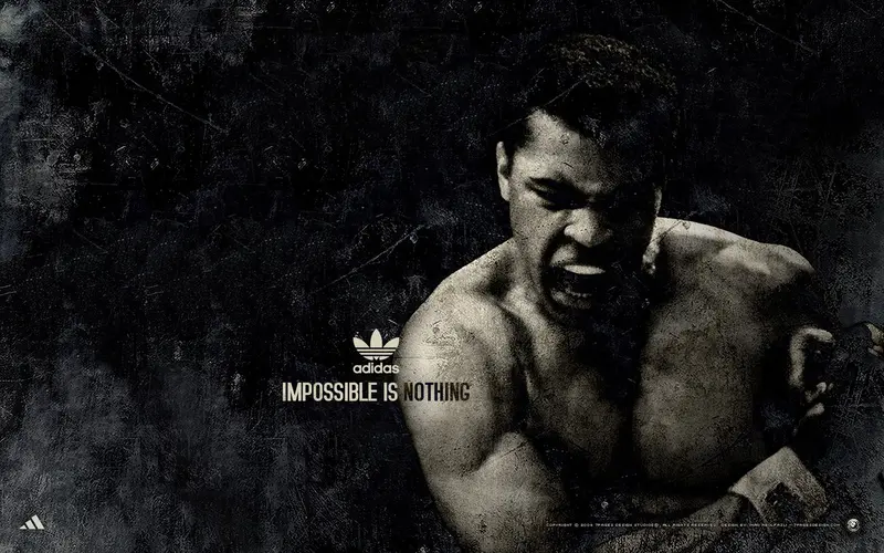 Muhammad Ali in an Adidas “Impossible Is Nothing” campaign image, representing the power of challenging perceived limits.