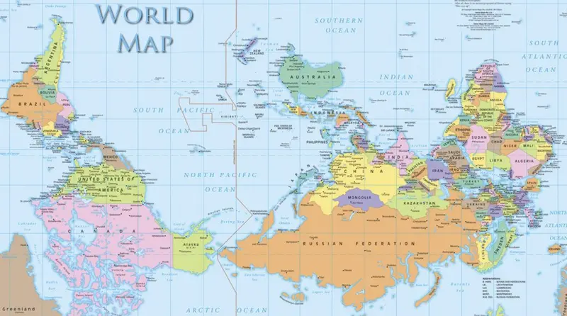 Upside-down world map with the south at the top and Australia near the top, labels still reading the right way up